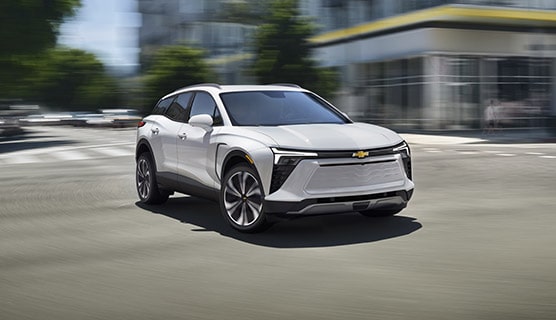 A GM Fleet vehicle driving alone in the city.