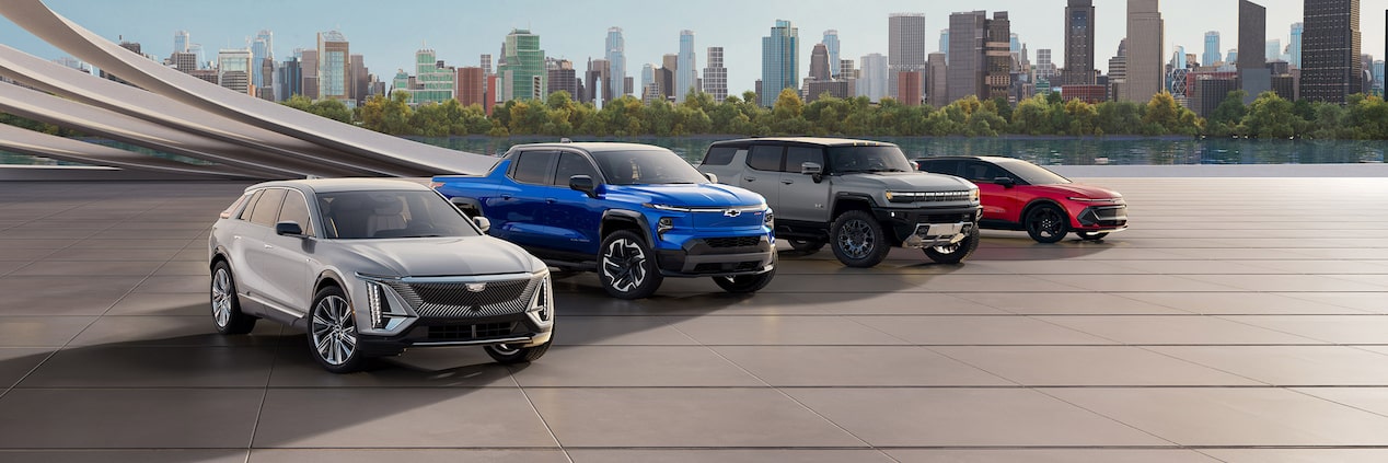 Multiple GM Fleet vehicles parked together outdoors.