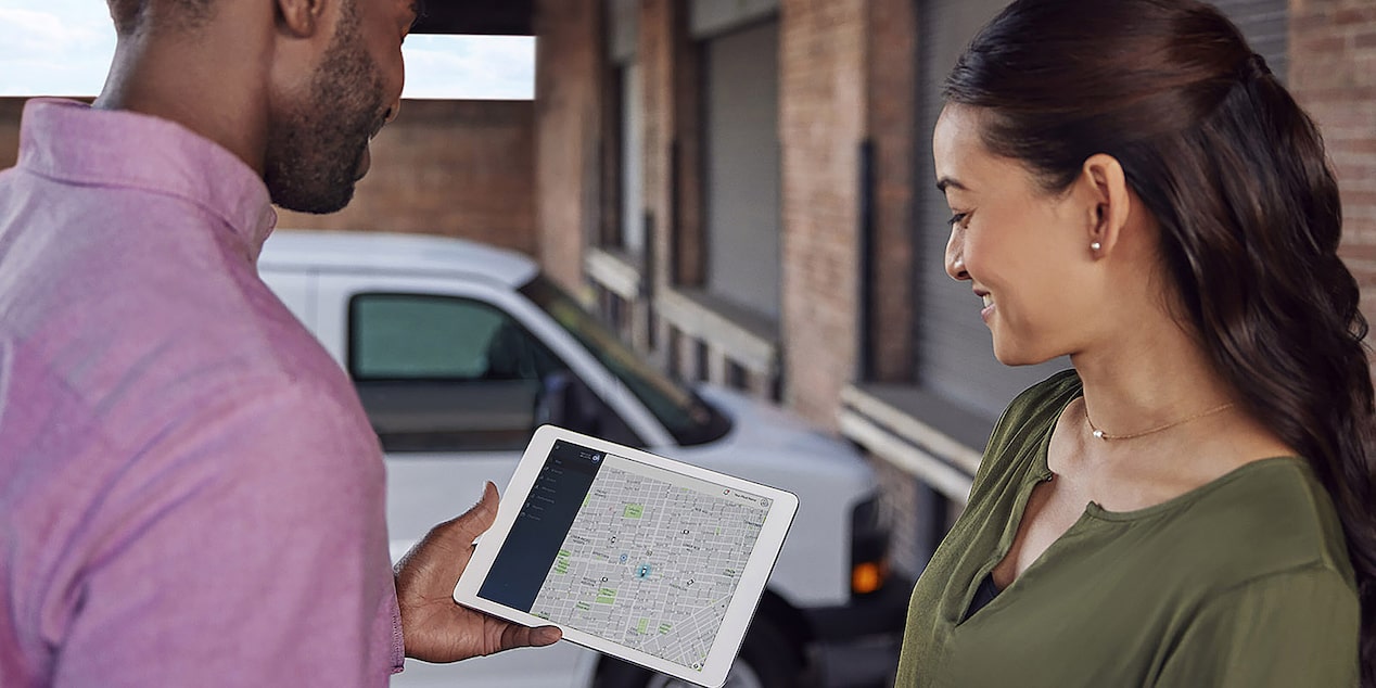 Side view of a man looking at a computer screen.
