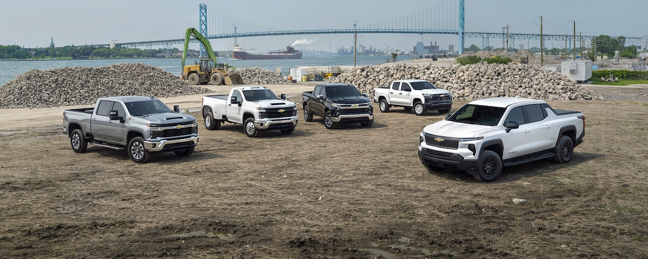 Multiple GM Fleet vehicles parked at a construction site.