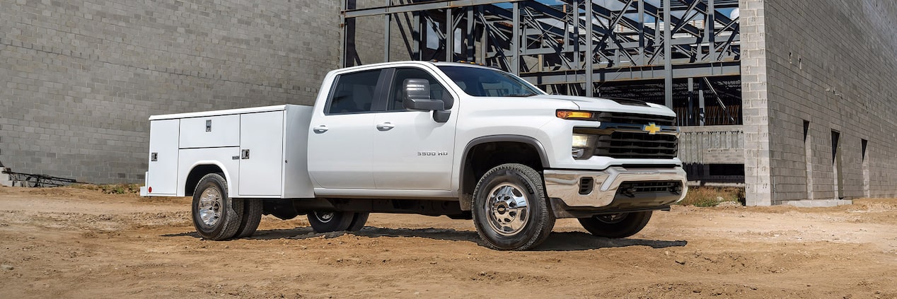 Side view of a GM Fleet Upfit-applied vehicle parked at a construction site.