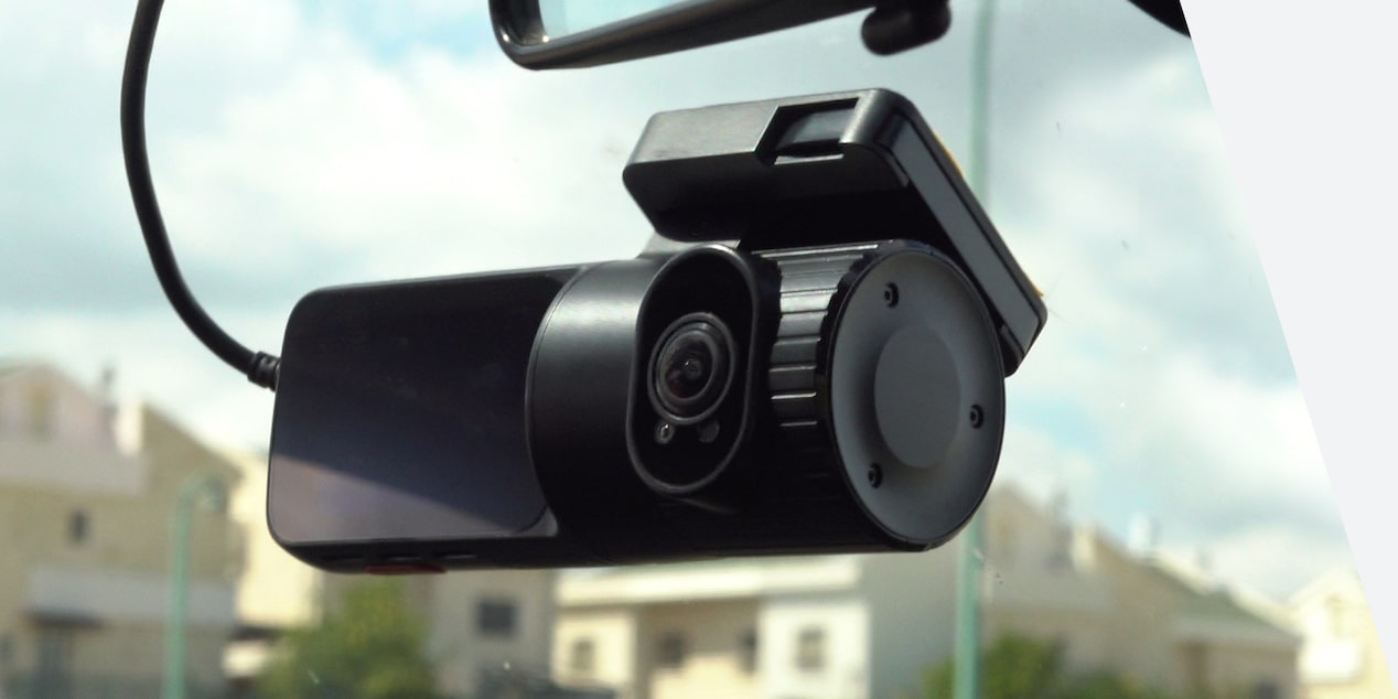Close-up view of the OnStar DualCam attached to a GM Fleet vehicle.